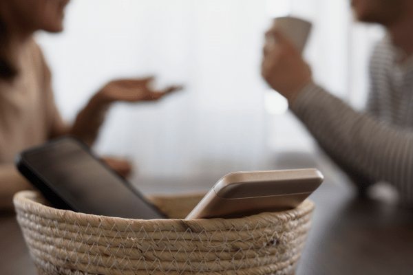 phones sitting in basket for digital detox 