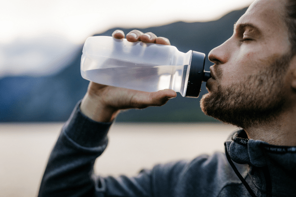 Man drinking from water bottle