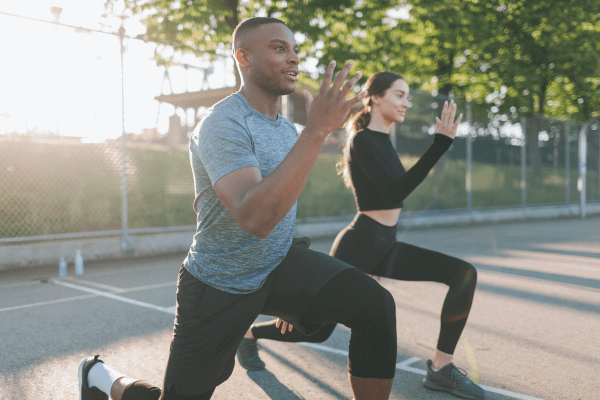 Man and woman exercising outside