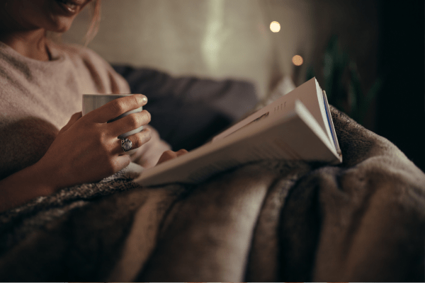 Woman reading before bed