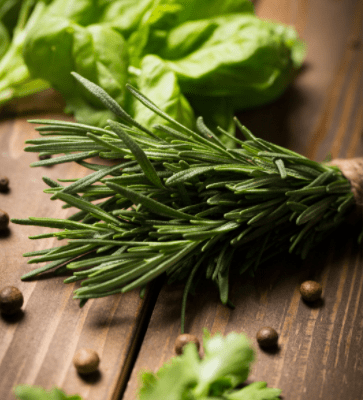 image of herbs lying on wood table