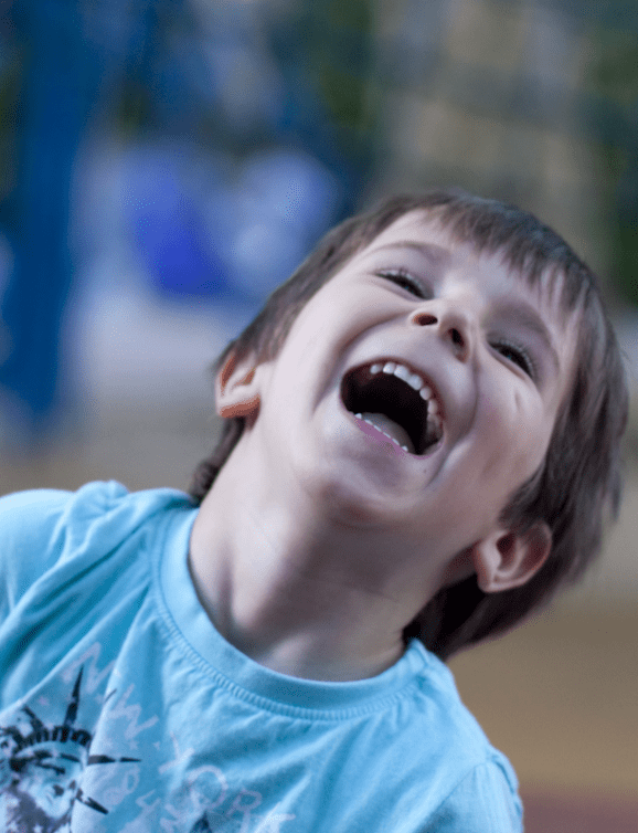 Child laughing in park