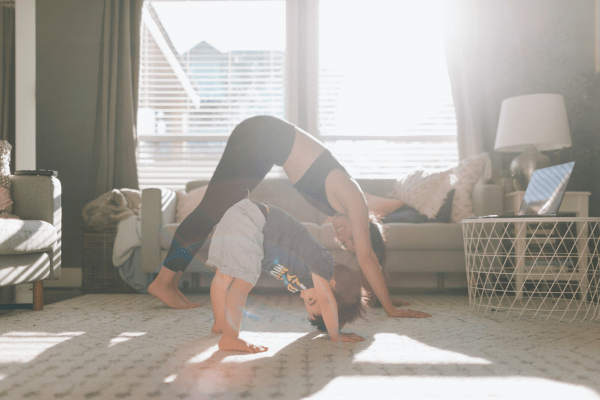 Mother and Child stretching in yoga pose