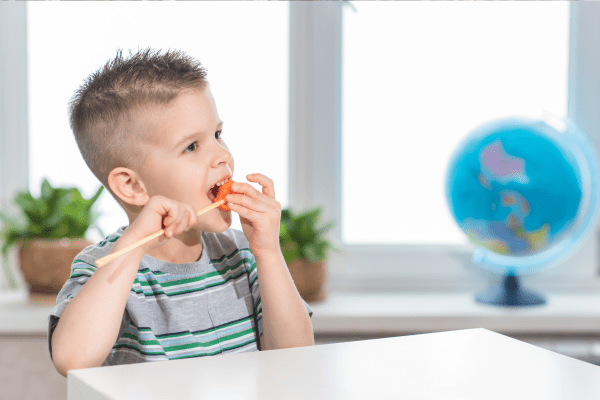 Child eating snack before yoga