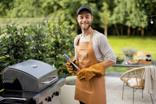 Practice grilling safety with a proper apron and gloves