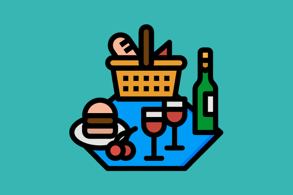 hamburger, wine, and bread set out on a picnic blanket