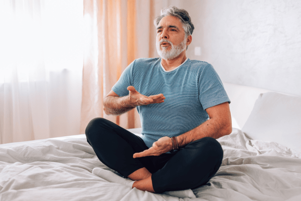 Man enhancing mind-body connection through breathing exercises